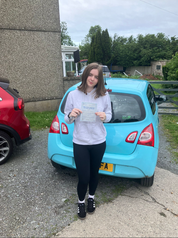 Pupil celebrating passing their driving test