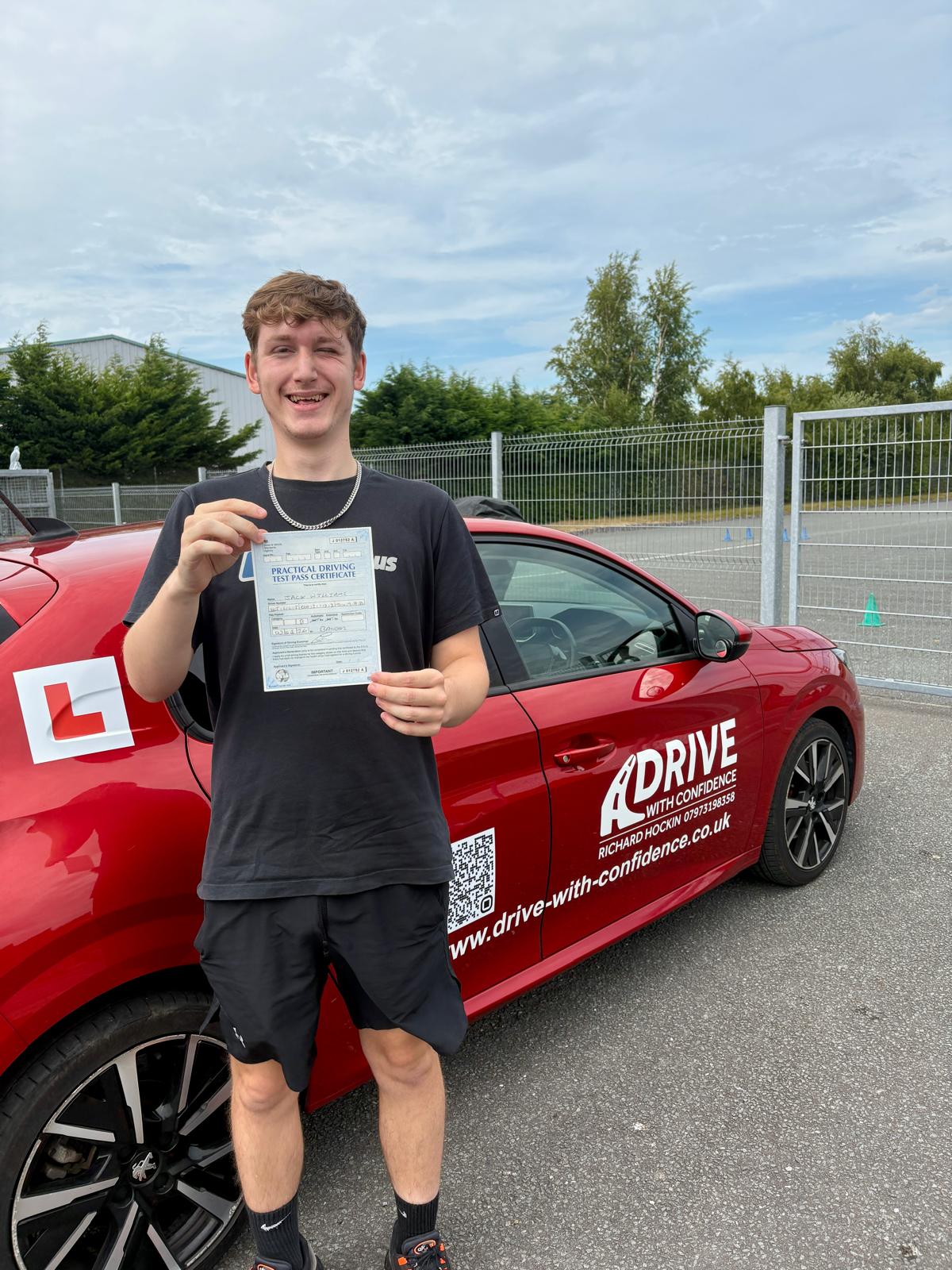 Pupil celebrating passing their driving test