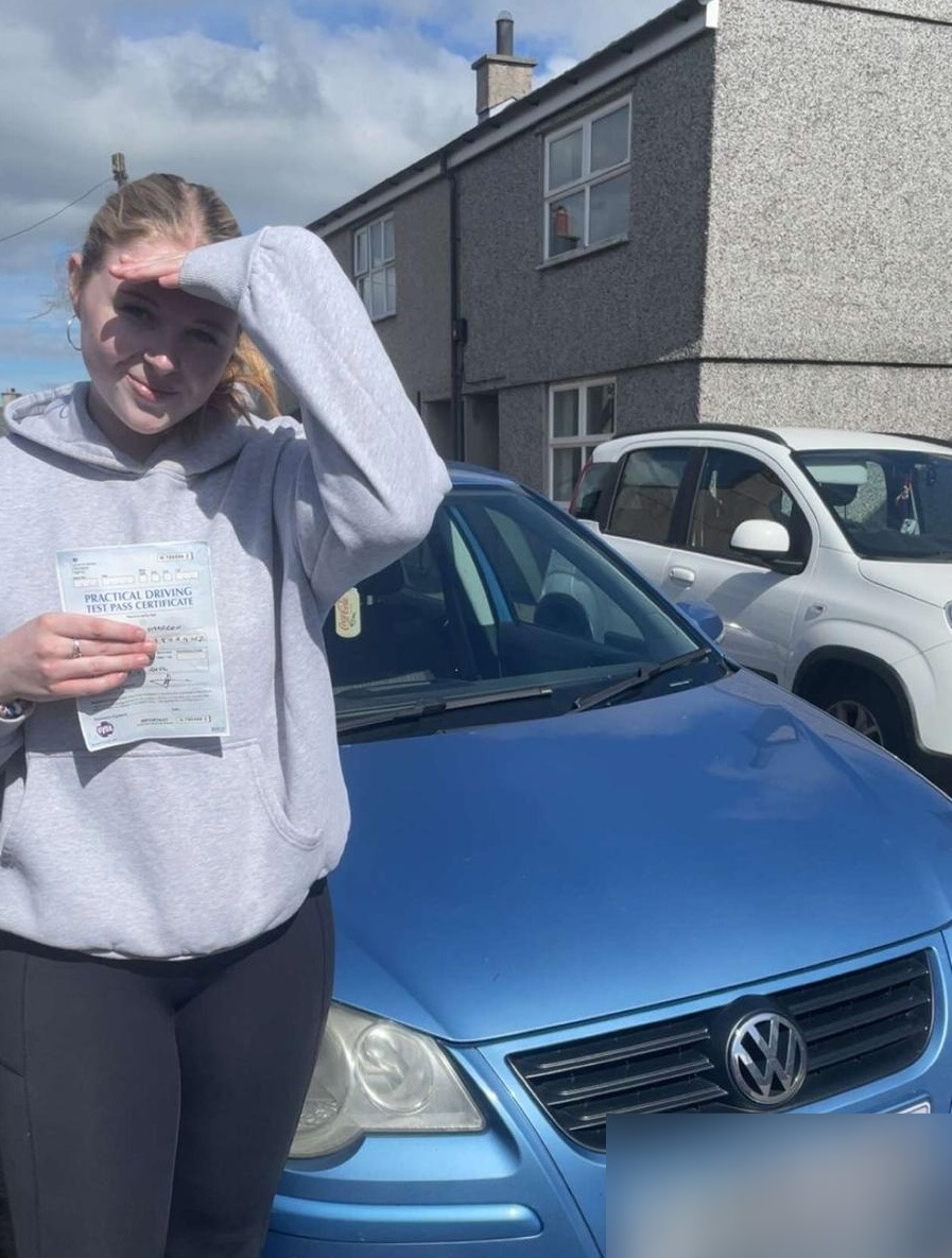 Pupil celebrating passing their driving test